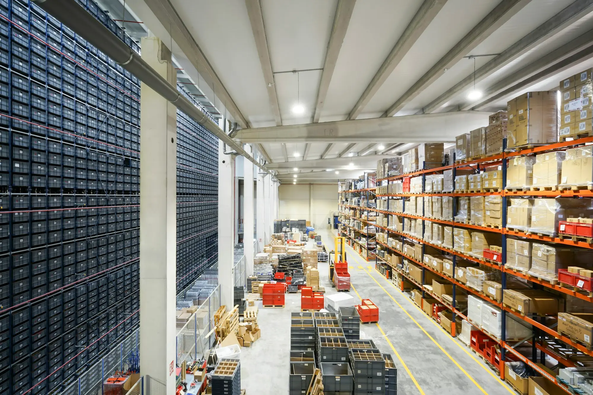 Warehouse aisles stacked with boxed stock ready for online orders