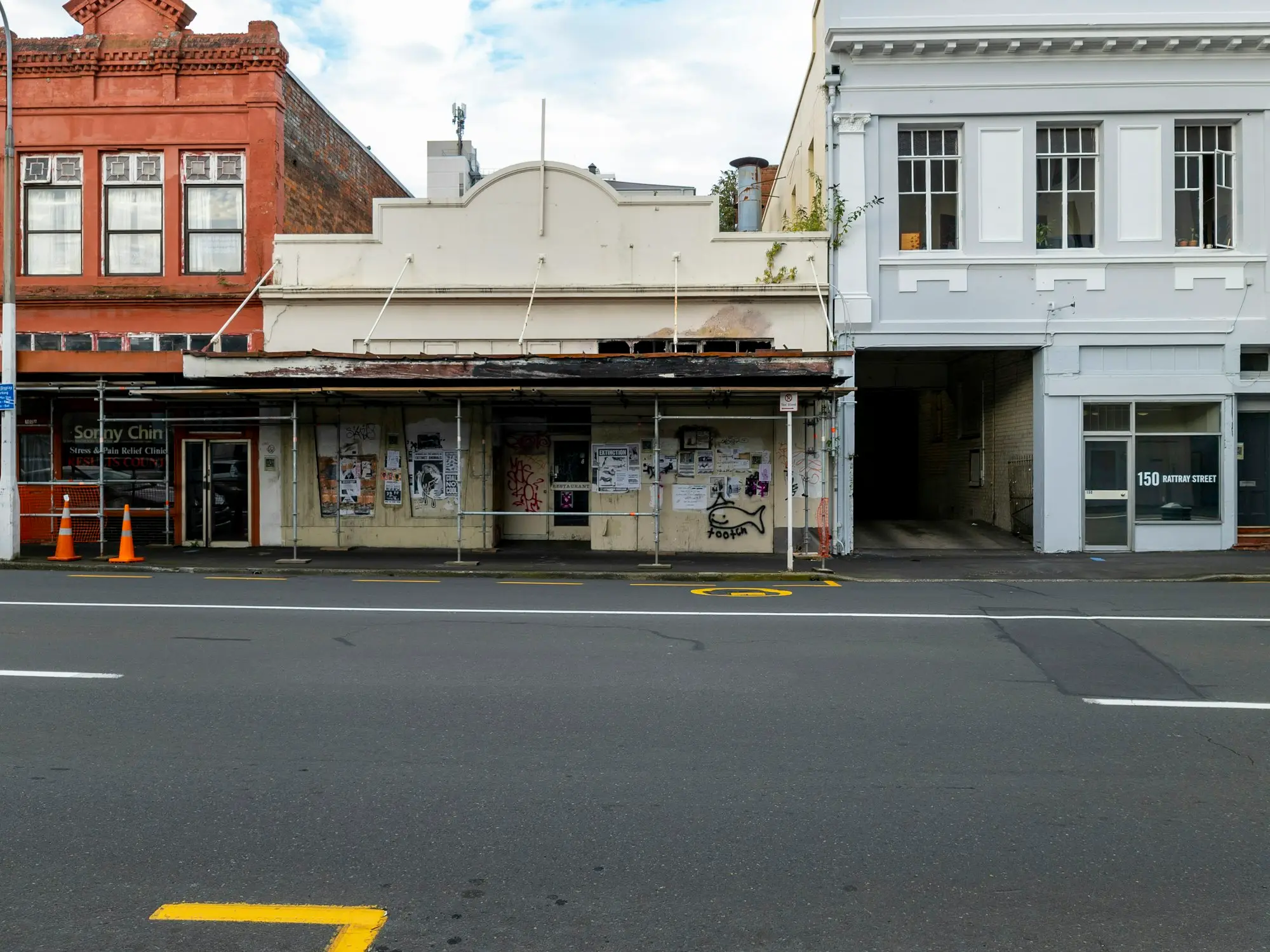 Vacant heritage shopfronts along a quiet main street ready for lease