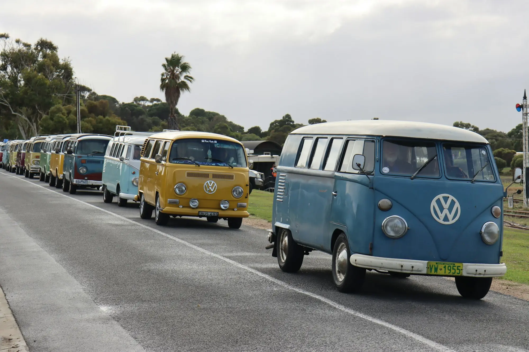 Row of vans parked along a country street in Milang, South Australia